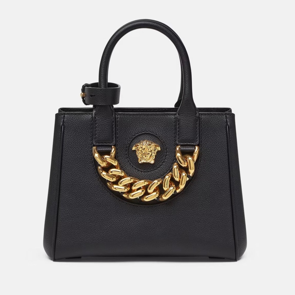 Brand new Versace women handbag with 2 zippers inside and long strap.